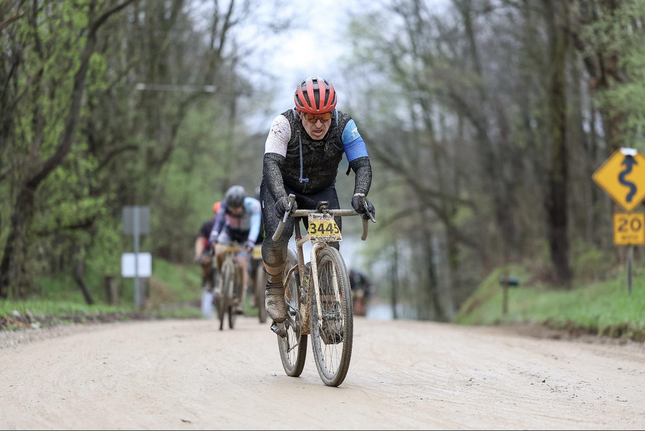 Roy Krauthamer racing gravel, covered in mud